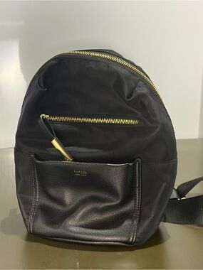 Tutilo New York Black Nylon/Vinyl Mini Backpack with Gold Zipper.